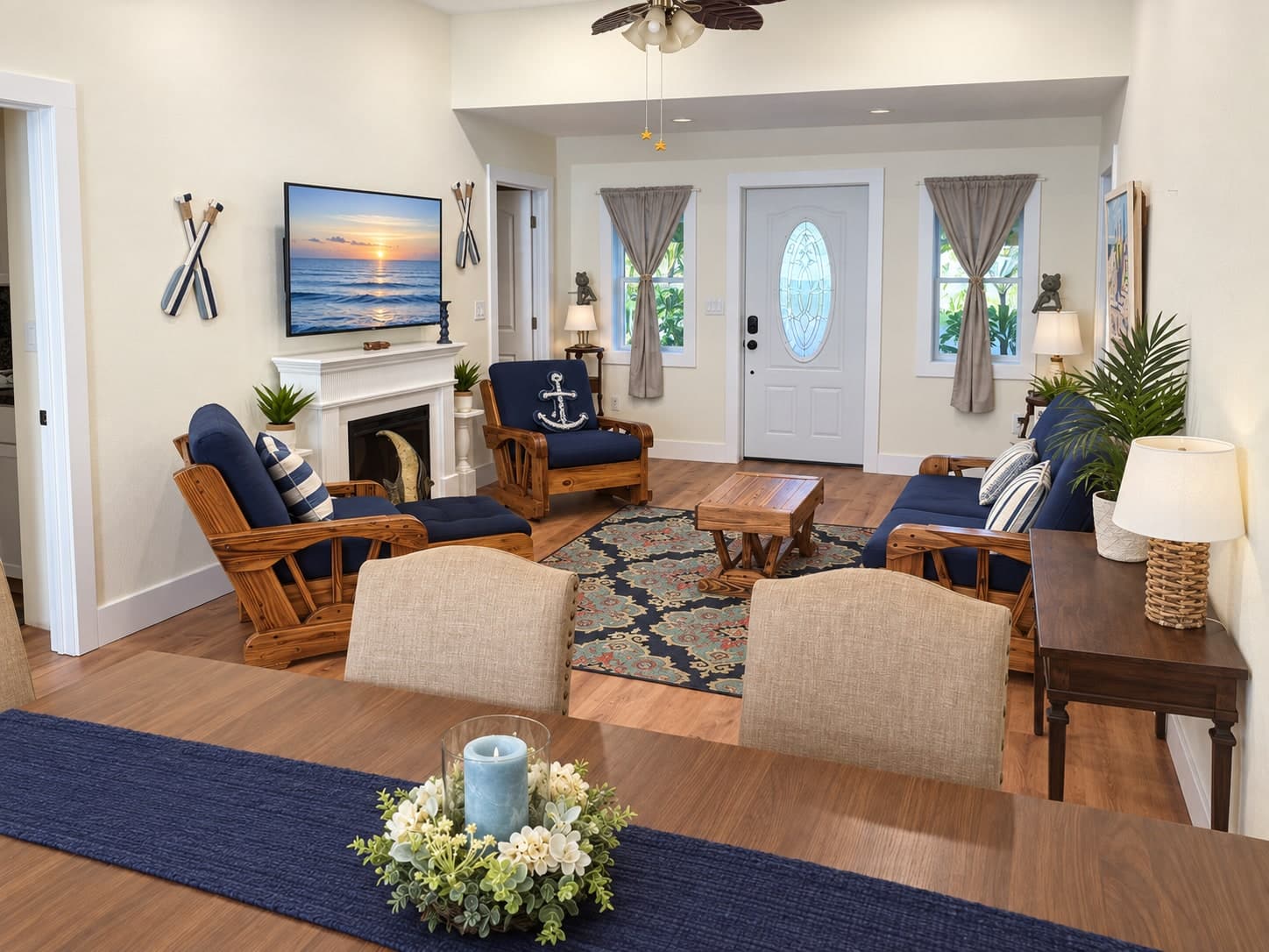 Bright waterfront living room with nautical decor and dining table